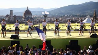 TotalEnergies team riders line the stage during the team presentation for the 111th edition of the Tour de France cycling race, on Piazzale Michelangelo in Florence in Italy, on June 27, 2024. 
Anne-Christine POUJOULAT / AFP