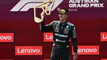 Winner Mercedes' British driver George Russell celebrates on the podium with the trophy after the Formula One Austrian Grand Prix at the Red Bull Ring race track in Spielberg, Austria on June 28, 2026. 
Joe Klamar / AFP