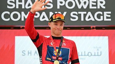 Lidl-Trek team's Italian rider Jonathan Milan celebrates on the podium after winning the first stage of the UAE Tour cycling race from Shams Solar Power Station Madinat Zayed to Liwa Palace in Abu Dhabi on February 17, 2025. 
Giuseppe CACACE / AFP