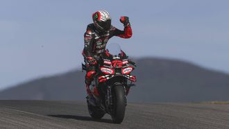 epa12511823 Aprilia Racing rider Marco Bezzecchi of Italy
celebrates after the MotoGP qualifying for the Motorcycling Grand Prix of Portugal, in Portimao, Portugal, 08 November 2025. The 2025 Motorcycling Grand Prix of Portugal is held at the Algarve International Circuit on 09 November.  EPA/JOSE SENA GOULAO