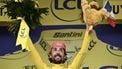 Guest and EF Education - EasyPost team's Irish rider Ben Healy celebrates on the podium with the overall leader's yellow jersey after the 10th stage of the 112th edition of the Tour de France cycling race, 165.3 km between Ennezat and Le Mont-Dore Puy de Sancy, in central France, on July 14, 2025. 
Marco BERTORELLO / AFP