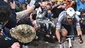 A spectator spills liquid as Alpecin-Deceuninck's Dutch rider Mathieu van der Poel cycles during the 122nd edition of the Paris-Roubaix one-day classic cycling race, 259,2 km between Compiegne and Roubaix, northern France on April 13, 2025. 
Bernard PAPON / POOL / AFP