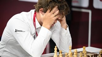 World champion and highest rancked chess player Norway's Magnus Carlsen (L) plays against a Russia opponent during the 10th round of the FIDE World Rapid and Blitz Championships 2025 at the Sports and Events Complex, at Qatar University in Doha on December 28, 2025. 
Mahmud HAMS / AFP