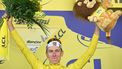 UAE Team Emirates - XRG team's Slovenian rider Tadej Pogacar celebrates on the podium with the overall leader's yellow jersey after the 5th stage of the 112th edition of the Tour de France cycling race, 33 km individual time trial starting and finishing in Caen, northwestern France, on July 9, 2025. 
Loic VENANCE / AFP