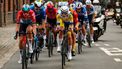 Dutch Pascal Eenkhoorn of Lotto Dstny (L) and Belgian Victor Vercouillie of Team Flanders Baloise (C) compete in the men elite 'Dwars Door Vlaanderen' cycling race, 188,6 km from Roeselare to Waregem, on March 27, 2024. 
DAVID PINTENS / Belga / AFP