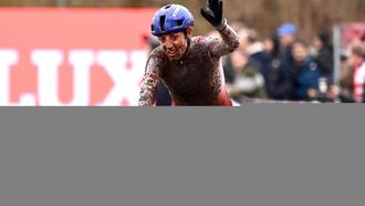 Dutch Lucinda Brand celebrates as she crosses the finish line in the women's elite race during the UCI World Cup cyclocross competition,  in Maasmechelen on January 25, 2025. 
LUC CLAESSEN / Belga / AFP