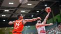Netherlands' Jesse Edwards (L) and Austria's Daniel Friedrich vie for the ball during pre-qualification match for the 2027 Men's Basketball World Cup between Austria and the Netherlands in Schwechat, Austria, on August 13, 2025. 
GEORG HOCHMUTH / APA / AFP