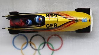 epa09769049 Mariama Jamanka and Alexandra Burghardt of Germany in action during Heat 1 of the Two-Woman Bobsleigh race at the Yanqing National Sliding Centre at the Beijing 2022 Olympic Games, Beijing municipality, China, 18 February 2022.  EPA/GUILLAUME HORCAJUELO