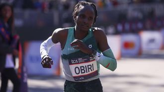 epa11699358 Kenya's Hellen Obiri crosses the finish line to win second place in the women's pro open race during the 2024 New York City Marathon in New York, New York, USA, 03 November 2024.  EPA/SARAH YENESEL