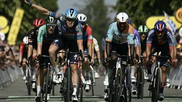Soudal Quick-Step team's Belgian rider Tim Merlier sprints to the finish line to win the 8th stage ahead of NSN Cycling Team's Eritrean rider Biniam Girmay (2nd R) and Decathlon CMA CGM Team's Dutch rider Olav Kooij (L) during the 113th edition of the Tour de France cycling race, 182 km between Périgueux and Bergerac in southwestern France, on July 11, 2026. 
Loic VENANCE / AFP