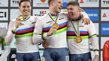 (L-R) Gold medalists Netherlands' Harrie Lavreysen, Jeffrey Hoogland and Roy van den Berg celebrate on the podium after winning the men's team sprint final during the 2026 UCI Track World Championships at the Shanghai Velodrome in Shanghai on October 14, 2026. 
STR / AFP