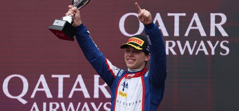 Third-placed Trident driver Laurens van Hoepen of the Netherlands celebrates on the podium after the Round 1 Melbourne Feature Race of the Formula 2 Championship at Albert Park Circuit on March 8, 2026, ahead of the Formula One Australian Grand Prix. 
Martin KEEP / AFP