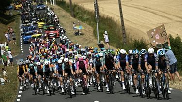 The pack of riders (peloton) cycles during the 8th stage of the 113th edition of the Tour de France cycling race, 180,4 km between Perigueux and Bergerac in southwestern France, on July 11, 2026. 
Loic VENANCE / AFP