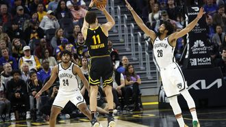 epa11033479 Golden State Warriors guard Klay Thompson (C) shoots a two point basket as Brooklyn Nets guard Spencer Dinwiddie (R) defends  during the fourth quarter of the NBA game between the Golden State Warriors and the Brooklyn Nets in San Francisco, California, USA, 16 December 2023.  EPA/JOHN G. MABANGLO  SHUTTERSTOCK OUT