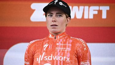 Team SD Worx - Protime's Dutch rider Demi Vollering looks on as she celebrates on the podium after winning the 8th and last stage of the third edition of the Women's Tour de France cycling race, a 149.9 km between Le Grand Bornand and the Alpe d'Huez, in L'Alpe d'Huez, south-eastern France, on August 18, 2024. 
JULIEN DE ROSA / AFP