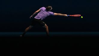 USA's Taylor Fritz hits a return against Chile's Cristian Garin during their men's singles match on day five of the Australian Open tennis tournament in Melbourne on January 16, 2025. 
Paul Crock / AFP