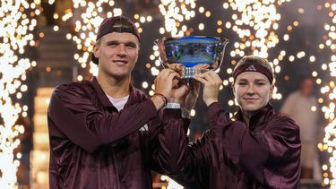 Czech Republic's Jakub Mensik and Czech Republic's Karolina Muchova hold up the trophy after they beat Switzerland's Belinda Bencic and Italy's Flavio Cobolli in the mixed doubles final tennis match of the 2026 US Open tennis tournament at the USTA Billie Jean King National Tennis Center in New York on August 26, 2026. 
TIMOTHY A. CLARY / AFP