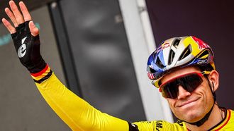 Belgian Wout van Aert of Team Visma-Lease a Bike waves ahead of the men elite 'Dwars Door Vlaanderen' cycling race, 188,6 km from Roeselare to Waregem, on March 27, 2024. 
DAVID PINTENS / Belga / AFP