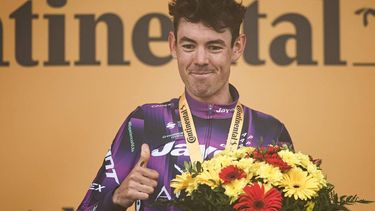 Team Jayco AlUla team's Australian rider Ben O'Connor celebrates on the podium after winning the 18th stage of the 112th edition of the Tour de France cycling race, 171.5 km between Vif and Courchevel Col de la Loze, in the Alps, southeastern France, on July 24, 2025. 
Anne-Christine POUJOULAT / AFP