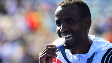 epa11541847 Silver medalist Bashir Abdi of Belgium poses for photos with his medal during a venue ceremony at Invalides following the Men's Marathon event of the Athletics competitions in the Paris 2024 Olympic Games in Paris, France, 10 August 2024.  EPA/CHRISTIAN BRUNA
