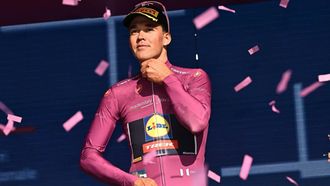 epa12096810 Danish rider Mads Pedersen of Lidl Trek Team wearining the points classification leader's cyclamen jersey, celebrates on the podium after 4th stage of the Giro d'Italia cycling tour over 189 km from Alberobello to Lecce, Alberobello, Italy, 13 May 2025.  EPA/LUCA ZENNARO