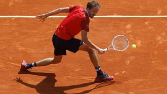 epa11272152 Daniil Medvedev of Russia hits a backhand during his Round of 16 match against Karen Khachanov of Russia at the ATP Monte Carlo Masters tennis tournament in Roquebrune Cap Martin, France, 11 April 2024.  EPA/SEBASTIEN NOGIER