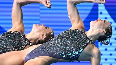 Netherlands' Bregje De Brouwer and Netherlands' Noortje De Brouwer compete in the duet technical routine of the artistic swimming event during the Paris 2024 Olympic Games at the Aquatics Centre in Saint-Denis, north of Paris, on August 9, 2024. 
Manan VATSYAYANA / AFP