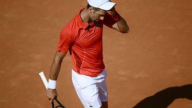 Serbia's Novak Djokovic reacts after being defeated by Chile's Alejandro Tabilo at the Men's ATP Rome Open tennis tournament at Foro Italico in Rome on May 12, 2024.  
Filippo MONTEFORTE / AFP
