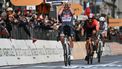 Dutch Mathieu Van Der Poel of team Alpecin-Deceuninck celebrates as he crosses the finish line to win the Milan - Sanremo one-day classic cycling race, on March 22, 2025. Dutch Mathieu Van Der Poel of team Alpecin-Deceuninck won the race ahead of Team Ineos' Italian rider Filippo Ganna and Team UAE's Slovenian rider Tadej Pogacar, third. 
Marco BERTORELLO / AFP
