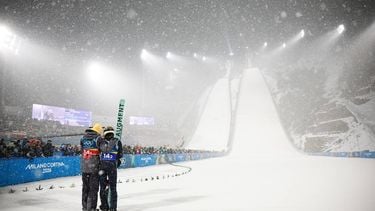 epa12747915 Andreas Wellinger (L) and Philipp Raimund (R) of Germany move in the finish area during the Men's Super Team, final round, of the Ski Jumping competitions at the Milano Cortina 2026 Winter Olympic Games, in Predazzo, Italy, 16 February 2026.  EPA/HANNIBAL HANSCHKE