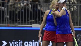 2023-11-10 20:09:38 Czech Republic's Barbora Krejcikova (R) and Katerina Siniakova talk together as they play against US Sloane Stephens and Taylor Townsend during the group stage group A doubles tennis match between Czech Republic and USA on the day 4 of the Billie Jean King Cup Finals 2023 in La Cartuja stadium in Seville on November 10, 2023. 
CRISTINA QUICLER / AFP