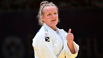 Netherlands' Sanne van Dijke (white) celebrates her victory over Greece's Elisavet Teltsidou (not in picture) after the final of the women's -70kg category of the Judo Masters 2023 in Budapest on August 5, 2023.   
ATTILA KISBENEDEK / AFP