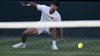 epa12206751 Carlos Alcaraz of Spain in action during the Men's 1st round match against Fabio Fognini of Italy at the Wimbledon Championships, Wimbledon, Britain, 30 June 2025.  EPA/TOLGA AKMEN  EDITORIAL USE ONLY EDITORIAL USE ONLY