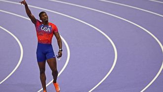 US' Fred Kerley gestures after competing in the men's 100m final of the athletics event at the Paris 2024 Olympic Games at Stade de France in Saint-Denis, north of Paris, on August 4, 2024. 
Anne-Christine POUJOULAT / AFP