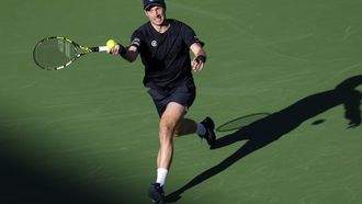 epa11950556 Botic Van de Zandschulp of the Netherlands in action against Novak Djokovic of Serbia during their men's second round match at the BNP Paribas Open tennis tournament in Indian Wells, California, USA, 08 March 2025.  EPA/JOHN G. MABANGLO