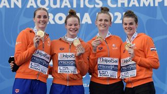 2022-08-11 20:26:26 Members of The Netherlands' team (From L) Marrit Steenbergen, Janna van Kooten, Silke Holkenborg and Imani De Jong celebrate on the podium with their Gold medal after winning the Women's 4 x 200m freestyle final event on August 11, 2022 during the LEN European Aquatics Championships in Rome. 
Filippo MONTEFORTE / AFP
