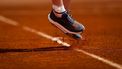 A photo shows the shoes of France's Leolia Jeanjean as she hits a return in her women's singles match against Hungary’s Amarissa Kiara Toth during the Billie Jean King Cup play-offs between France and Hungary, at Oeiras outskirts of Lisbon, on April 10, 2026. 
FILIPE AMORIM / AFP