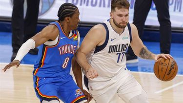 epa11330575 Dallas Mavericks guard Luka Doncic (R) dribbles past Oklahoma City Thunder forward Jalen Williams (L) during the second half of the NBA Western Conference Semifinal round playoff game two between the Dallas Mavericks and the Oklahoma City Thunder in Oklahoma City, Oklahoma, USA, 09 May 2024.  EPA/ADAM DAVIS SHUTTERSTOCK OUT