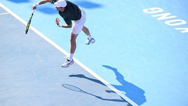 Netherlands' Botic Van De Zandschulp hits a return against China’s Shang Juncheng during their men's singles match at the Hong Kong Open tennis tournament in Hong Kong on January 3, 2024. 
Peter PARKS / AFP
