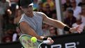 USA's Marcos Giron hits a return against Britain's Jack Draper during their men's singles match on day three of the Australian Open tennis tournament in Melbourne on January 16, 2024. 
WILLIAM WEST / AFP