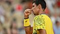 Australia's Alexei Popyrin reacts while playing Germany's Alexander Zverev in their men's singles third round tennis match on Court Suzanne-Lenglen at the Roland-Garros Stadium during the Paris 2024 Olympic Games, in Paris on July 31, 2024.  
PATRICIA DE MELO MOREIRA / AFP