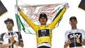 Tour de France 2018 winner Great Britain's Geraint Thomas (C), holds a Welsh flag and the overall leader's yellow jersey, second-placed Netherlands' Tom Dumoulin (L) and third-placed Great Britain's Christopher Froome (R) celebrate on the podium after the 21st and last stage of the 105th edition of the Tour de France cycling race between Houilles and Paris Champs-Elysees, on July 29, 2018.  
Jeff PACHOUD / AFP
