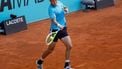 epa12052085 Jan-Lennard Struff of Germany in action against Botic Van de Zandschulp of the Netherlands during their first round match at the Madrid Open tennnis tournament in Madrid, Spain, 24 April 2025.  EPA/JUANJO MARTIN