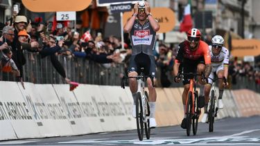 Dutch Mathieu Van Der Poel of team Alpecin-Deceuninck celebrates as he crosses the finish line to win the Milan - Sanremo one-day classic cycling race, on March 22, 2025. Dutch Mathieu Van Der Poel of team Alpecin-Deceuninck won the race ahead of Team Ineos' Italian rider Filippo Ganna and Team UAE's Slovenian rider Tadej Pogacar, third. 
Marco BERTORELLO / AFP