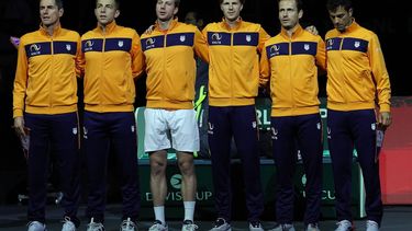 (From L) Netherlands' captain Paul Haarhuis, Tallon Griekspoor, Botic Van de Zandschulp, Gijs Brouwer, Wesley Koolhof and Jean-Julien Rojer listen to their national anthem prior to playing the third men's single quarter-final tennis match against Italy of the Davis Cup tennis tournament at the Martin Carpena sportshall, in Malaga on November 23, 2023. 
LLUIS GENE / AFP