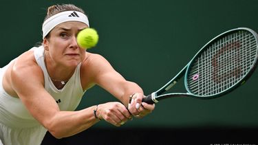 Ukraine's Elina Svitolina returns the ball to Tunisia's Ons Jabeur during their women's singles tennis match on the sixth day of the 2024 Wimbledon Championships at The All England Lawn Tennis and Croquet Club in Wimbledon, southwest London, on July 6, 2024. 
ANDREJ ISAKOVIC / AFP