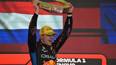 Red Bull Racing's Dutch driver Max Verstappen celebrates at the podium with the trophy of the Formula One Sao Paulo Grand Prix, at the Jose Carlos Pace racetrack, aka Interlagos, in Sao Paulo, Brazil, on November 3, 2024. 
NELSON ALMEIDA / AFP