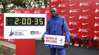 (FILES) Kenya's Kelvin Kiptum celebrates winning the 2023 Bank of America Chicago Marathon in Chicago, Illinois, in a world record time of two hours and 35 seconds on October 8, 2023.  World marathon record holder Kelvin Kiptum and his coach Gervais Hakizimana have died in a car crash in western Kenya that left a third passenger also injured, police said on February 11, 2024.
KAMIL KRZACZYNSKI / AFP