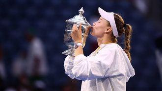 Kazakhstan's Elena Rybakina kisses the winner's trophy after winning the women's singles final tennis match against Belarus's Aryna Sabalenka on day fourteen of the US Open tennis tournament at the USTA Billie Jean King National Tennis Center in New York City on September 12, 2026. 
CHARLY TRIBALLEAU / AFP