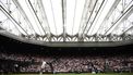Russia's Daniil Medvedev serves under the closed roof of Centre Court as he plays against Italy's Jannik Sinner during their men's singles quarter-final tennis match on the ninth day of the 2024 Wimbledon Championships at The All England Lawn Tennis and Croquet Club in Wimbledon, southwest London, on July 9, 2024. 
HENRY NICHOLLS / AFP